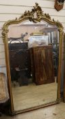 A late 19th century Louis XV style gilt and composite overmantel mirror W.95cm