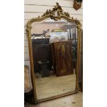 A late 19th century Louis XV style gilt and composite overmantel mirror W.95cm