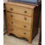 A pine four drawer chest