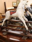 A Victorian carved painted rocking horse W.91cm