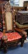 A pair of Thai carved hardwood "Throne" chairs W.92cm