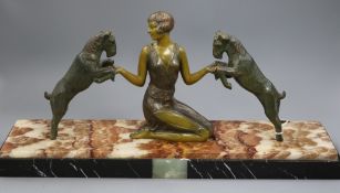 An Art Deco bronze model of a girl with two goats, onyx base, length 52cm