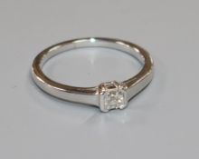 A modern 18ct white gold and asscher? cut solitaire diamond ring, the stone weighing approximately