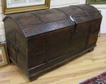 An antique domed oak coffer W.132cm