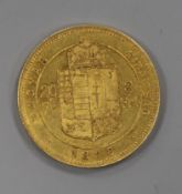 An 1878 Hungarian 8 Forint 20 Francs gold coin.