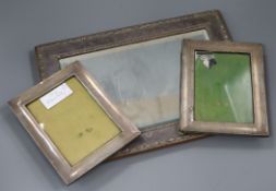 A George V silver mounted rectangular easel mirror and a pair of George V silver mounted
