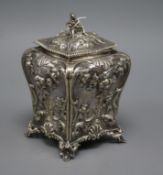 A Victorian embossed silver bombe shaped tea caddy, with figural finial, Charles Thomas Fox & George