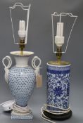 A Chinese blue and white cylindrical table lamp and a blue and white swan handled table lamp tallest