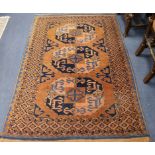 A Tekke red ground rug, with field of three octagons 170 x 121cm