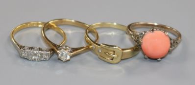 An 18ct gold and three stone diamond ring and three gem set rings including two 9ct.