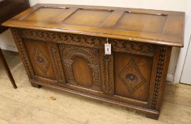 A carved oak coffer W.122cm