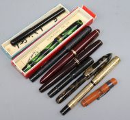 A collection of vintage pens, approximately nine