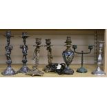 A pair of Putti candlesticks, two others and a lamp tallest 26cm