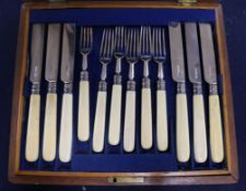 A cased set of twelve pairs of Edwardian ivory handled silver dessert eaters, Atkin Brothers,