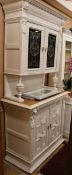 A late 19th century painted oak cabinet, with stained glass doors, W.110cm