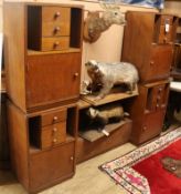 A 1930's oak dwarf cabinet and a pair of matching bedside cabinets Dwarf cabinet 175cm, pair 45cm