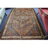 A Persian brown ground rug 247 x 161cm