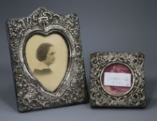 Two early 20th century repousse silver mounted photograph frames, one with heart shaped aperture,
