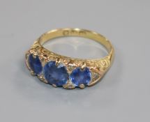 A late 19th/early 20th century sapphire and diamond half-hoop ring, size S.