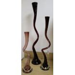 Three contemporary amethyst glass twist vases tallest 90cm