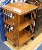 An Edwardian inlaid satinwood revolving bookcase W.48cm