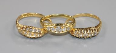Three 18ct gold and five stone diamond rings including two early 20th century.