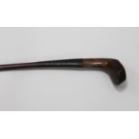 A late 19th century mahogany Sunday golf club walking stick, the head with lead back weight and bone