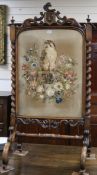 A Victorian carved walnut firescreen with needlework panel of a falcon W.68cm H.133cm