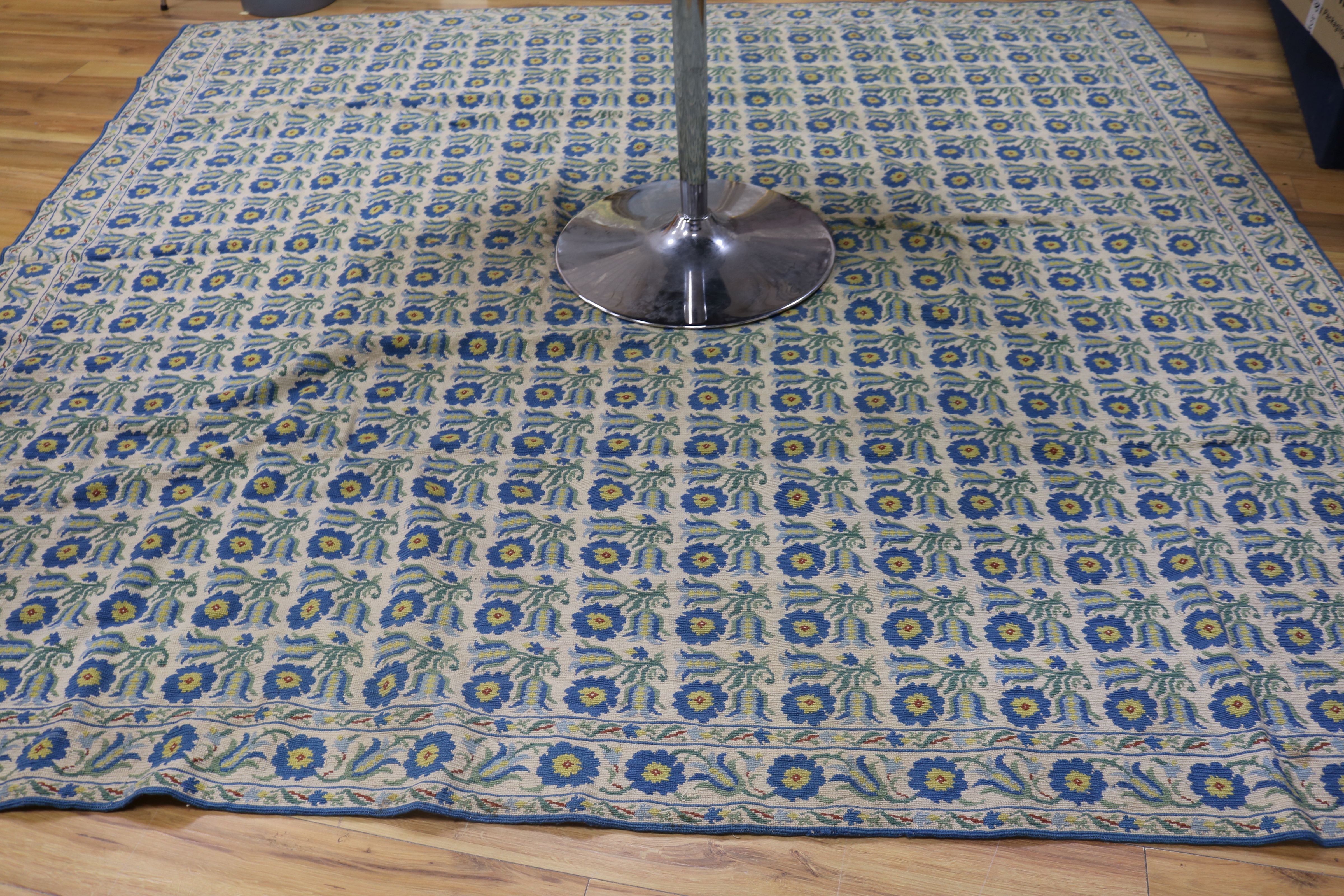 A cream ground Kelim carpet with dense field of flowers, 275 x 266cm and a Persian style rug, 185