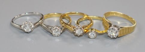 Five 18ct gold and solitaire diamond rings, including three illusion set and one in white gold