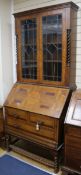 A 1920's parquetry and oak bureau bookcase W.98cm