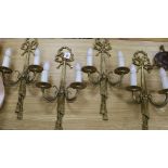 A set of four Louis XVI style gilt metal two branch wall lights length 57cm