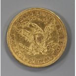 An 1895 US Liberty five dollar gold coin.