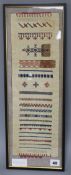 A 19th century Scandinavian sampler, framed, overall length 53.5cm