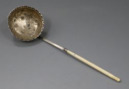 A continental white metal ladle, with embossed bowl and turned handle, 22cm.