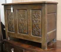 An early 18th century oak coffer, with later carving W.79cm