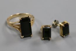 A 14ct gold and dark green tourmaline suite including a ring and pair of earrings.