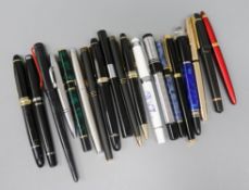 A collection of fountains pens, approximately nineteen