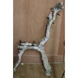 A pair of cast iron rustic garden bench ends