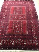 A Persian Tabriz style red ground carpet 252 x 173cm