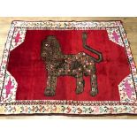 A Gabbeh red ground rug, decorated with a lion 182 x 144cm