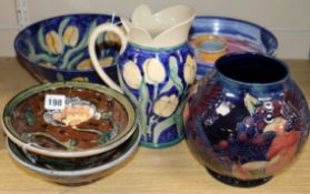 A Moorcroft Bird and Berry vase and sundry studio ceramics, the dark blue ground vase with green