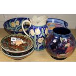 A Moorcroft Bird and Berry vase and sundry studio ceramics, the dark blue ground vase with green