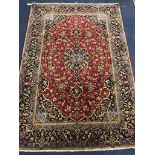 A Kashan blue and red ground carpet 200 x 138cm.