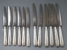 A set of six modern silver handled thread pattern table knives and six matching dessert knives,