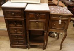 Three French walnut bedside cabinets, all with marble inset tops