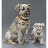 Two white glazed terracotta dogs tallest 42.5cm