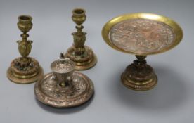 An Elkington & Co. inkwell, a tazza and matching pair of candlesticks tallest 15.5cm