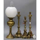 Three brass lamps and an oil lamp tallest 42cm