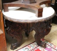 A late Victorian carved walnut occasional table, with simulated marble top W.80cm